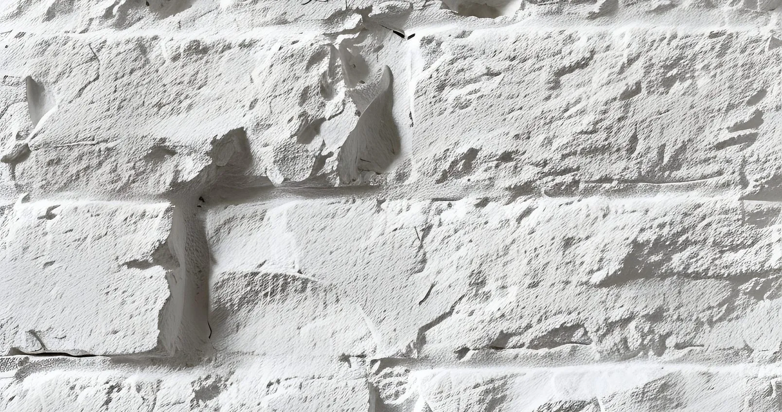 Mur en briques peintes en blanc